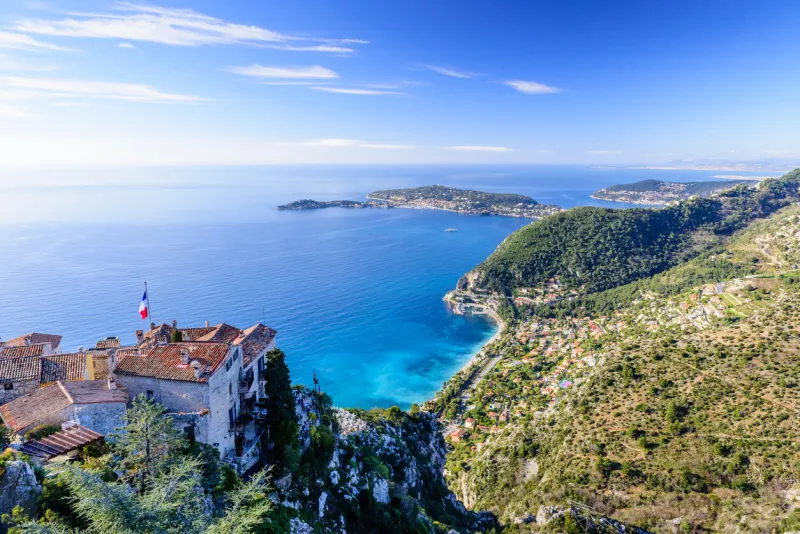 eze town, france - march 9, 2018  scenic view of the mediterranean coastline and medieval houses from the top of the town of eze village on the french riviera