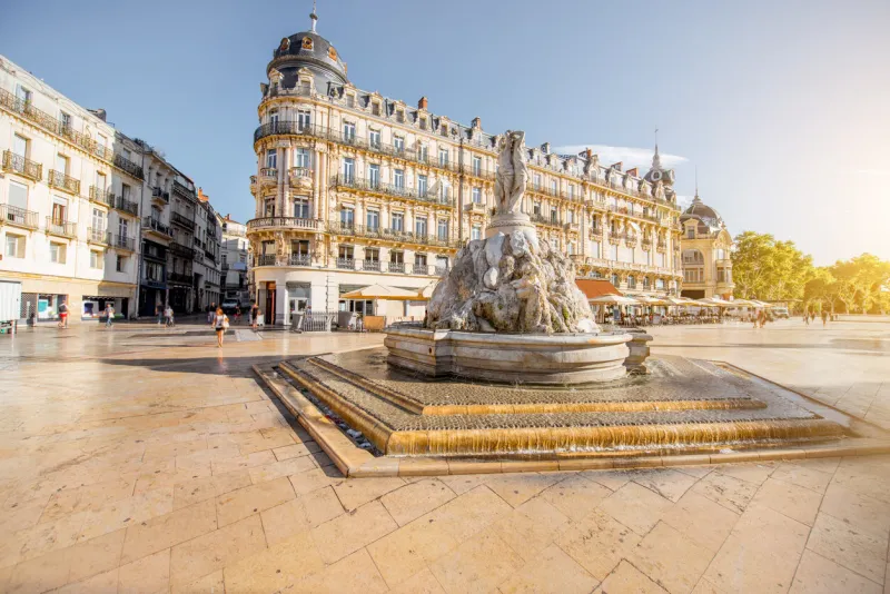 view on the comedy square with fountain of three graces during the morning light in montpellier city in southern france