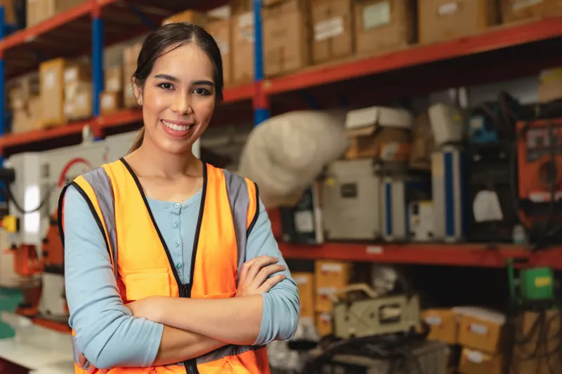 portrait smart woman worker asian girl teen work in warehouse factory inventory manager confident happy smiling