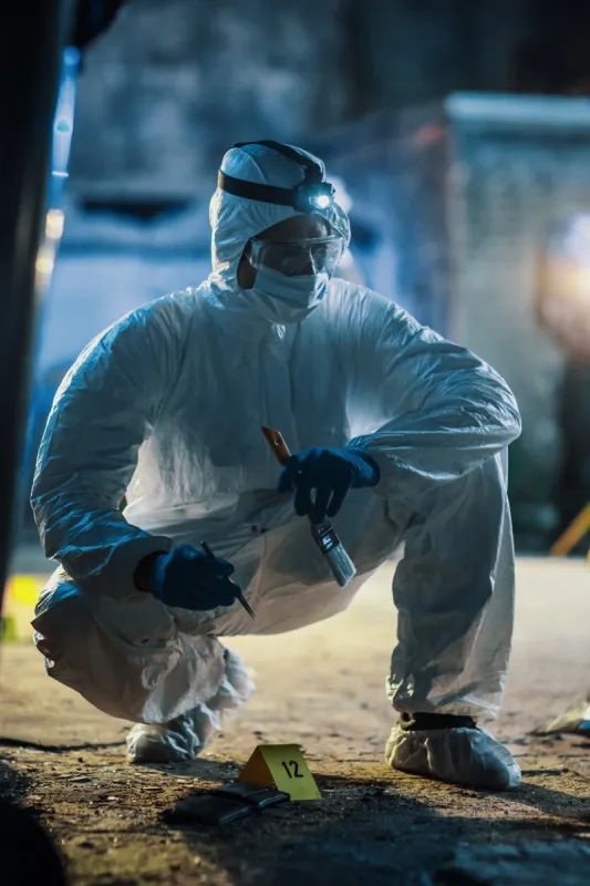 forensics specialist working with professional tools and equipment on evidence found on crime scene expert gathering traces of dna and fingerprints from a wallet that belongs to the victim of mugging