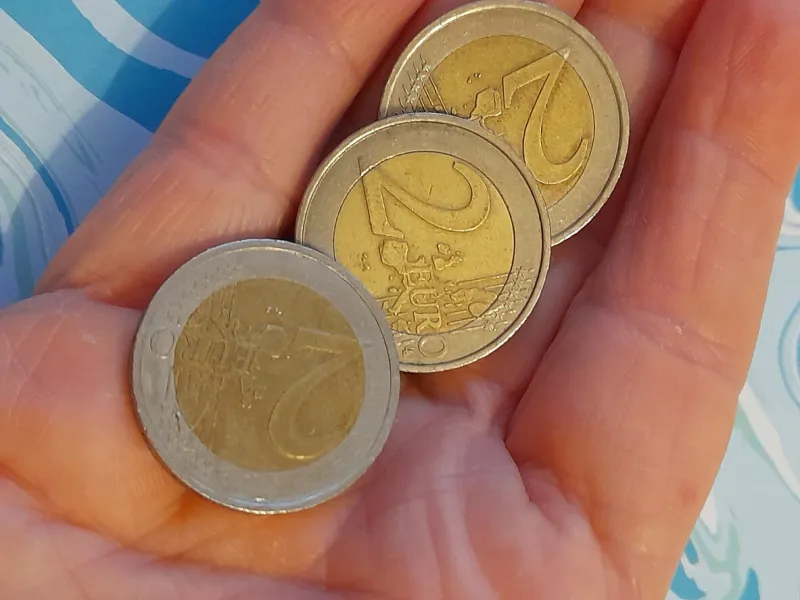 2 euro coins isolated in hand