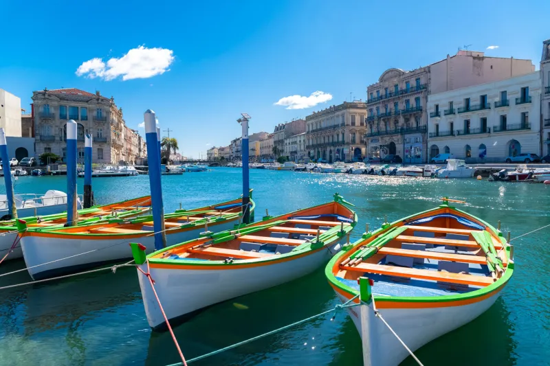 sete in france, traditional boats moored at the quay in the city centre