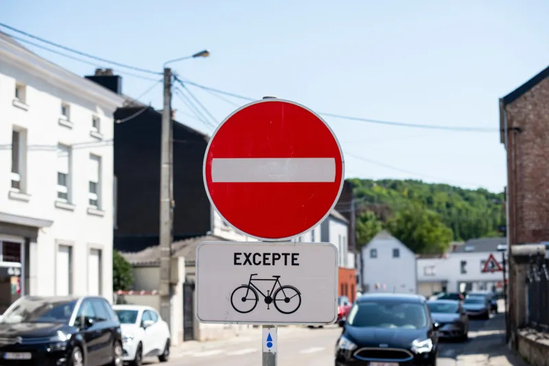 the road is closed red round sign white brick in red circle road sign allowed only for bikes