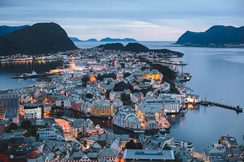 beautiful super wide-angle summer aerial view of alesund, norway, with skyline and scenery beyond the city, seen from the observation deck of aksla mountain