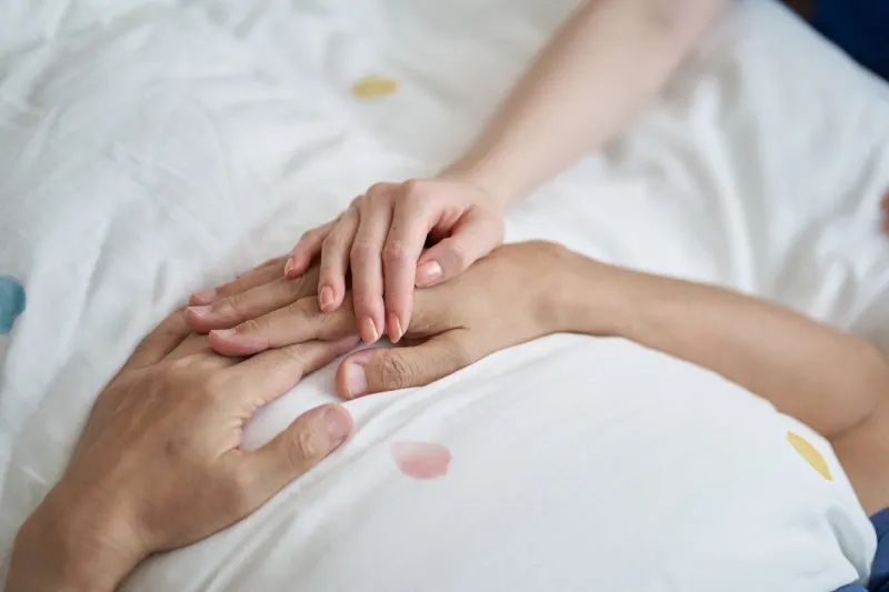 at the hands of an elderly asian who is seen at the end