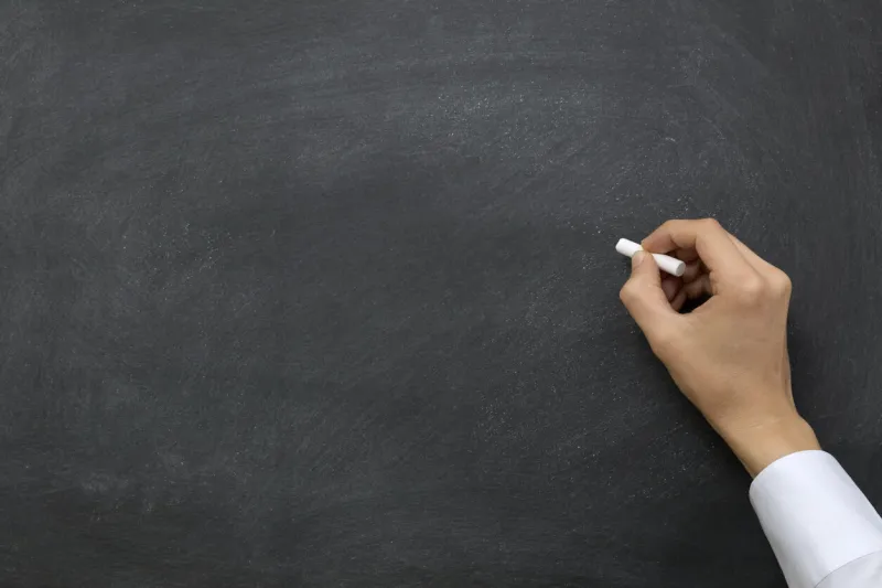 hand writing on chalkboard