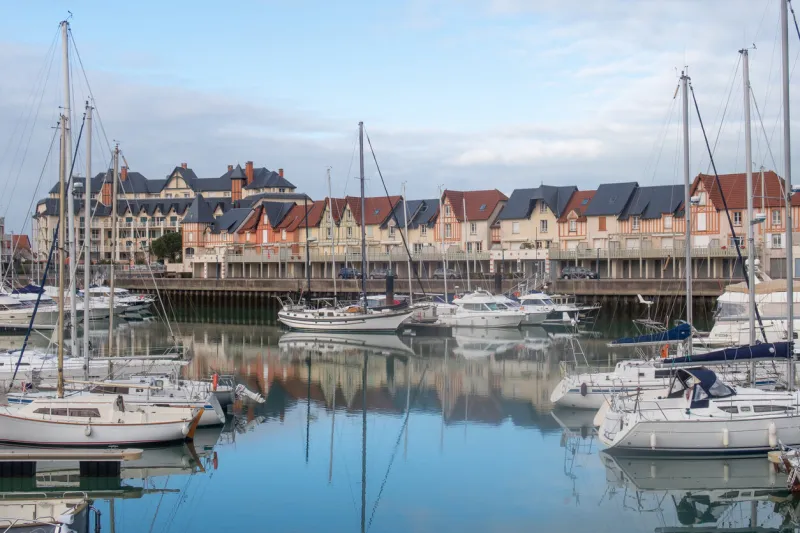 dives-sur-mer, france - january 3, 2019  the harbour, boats, and buildings at dives-sur-mer