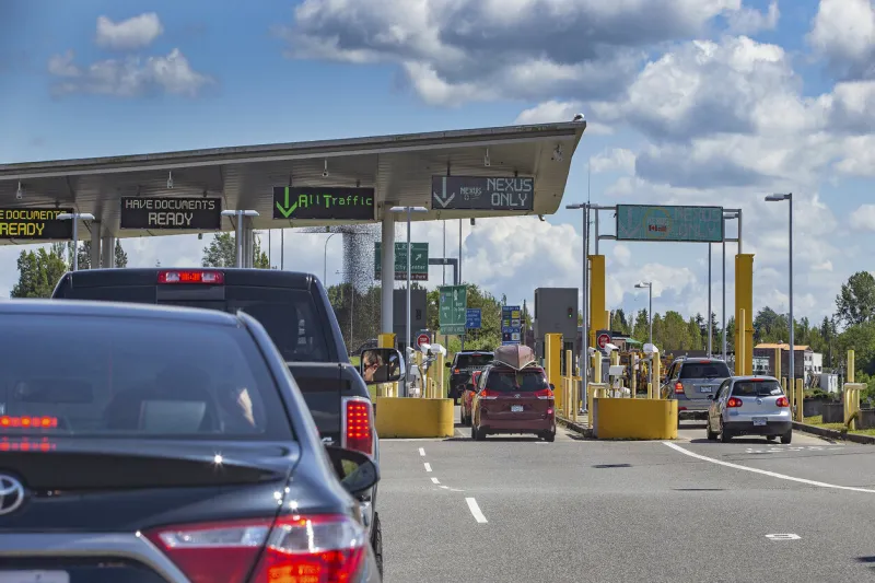 busy border crossing at us canada border, peace arch, washington state, usa