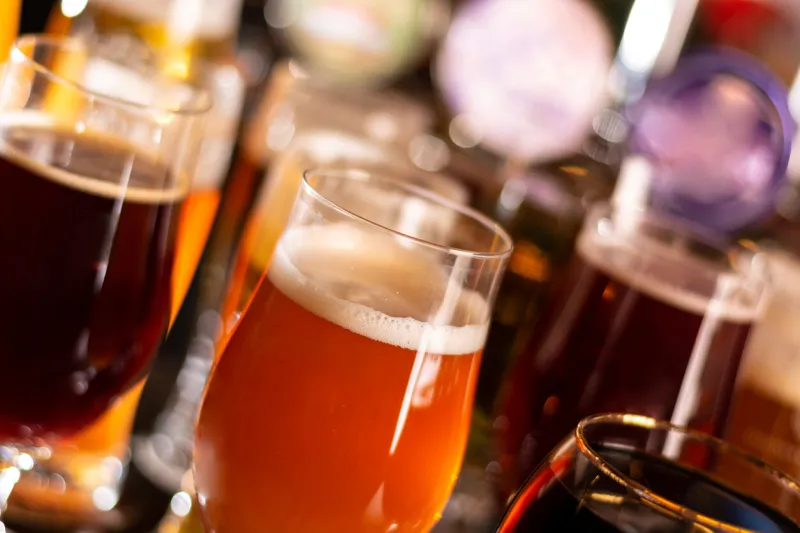 a lot of beers in glass on bar table