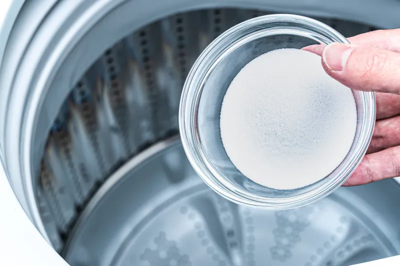 put baking soda into a washing machine