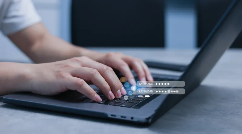 close up businessman type username and password on laptop to access private account of office for security system of business technology concept