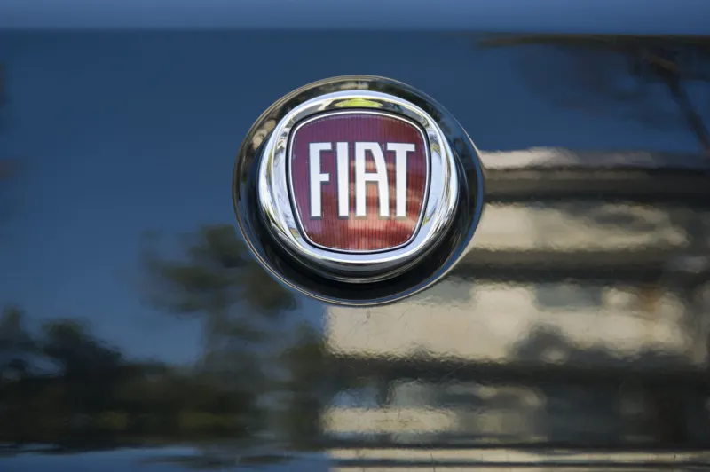 padua, italy - july 9, 2011  fiat metallic logo on a car rear hood fiat automobiles spa is an italian automaker which produces fiat branded cars since 1899 shot in a public parking