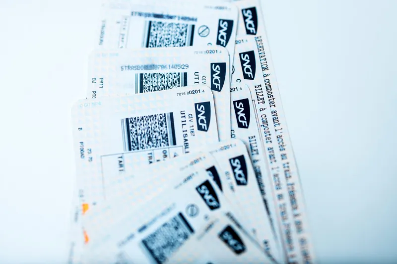 paris, france - january 14, 2015  train tickets for sncf - societe nationale des chemins de fer francais or national society of french railways on white bakground for mutiple destinations on tgv