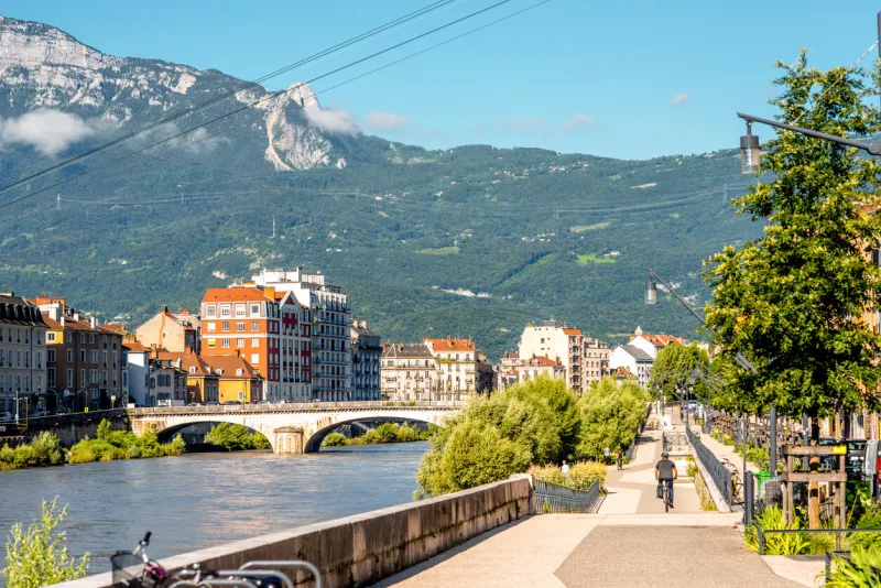 morning cityscape view with mountains, river and promenade in grenoble city on the south-east of france