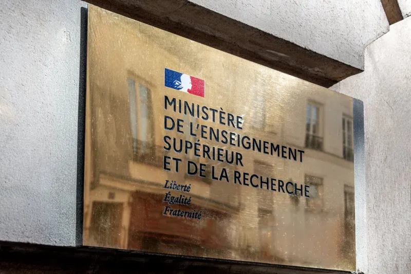 paris, france - october 4, 2024  close-up of the plaque at the entrance to the ministry of higher education and research building with the logo of the french republic