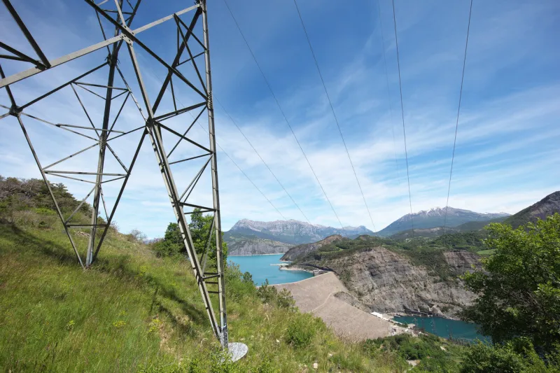 image taken, towards the south-east, on the heights of the dam with the serre-ponçon lake upstream and the espinnasse compensation lake downstream