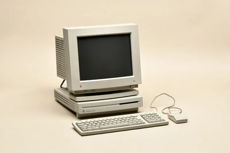 milan, lombardy, italy - june 16, 2019   macintosh lc iii from 1994 retro personal computer manufactured by apple computer inc with monitor, keyboard and mouse, isolated on beige background
