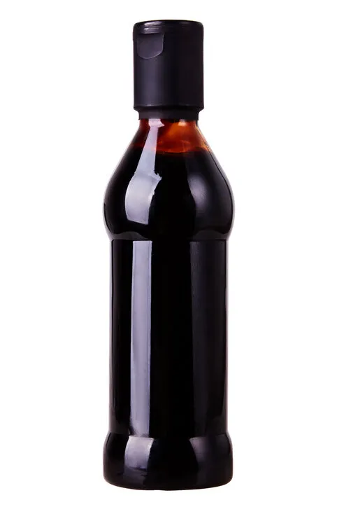 italian balsamic vinegar sauce in bottle isolated on white backgroung