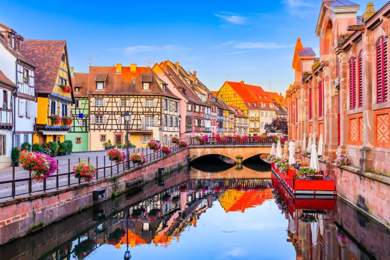 colmar, alsace, france petite venice, water canal and traditional half timbered houses