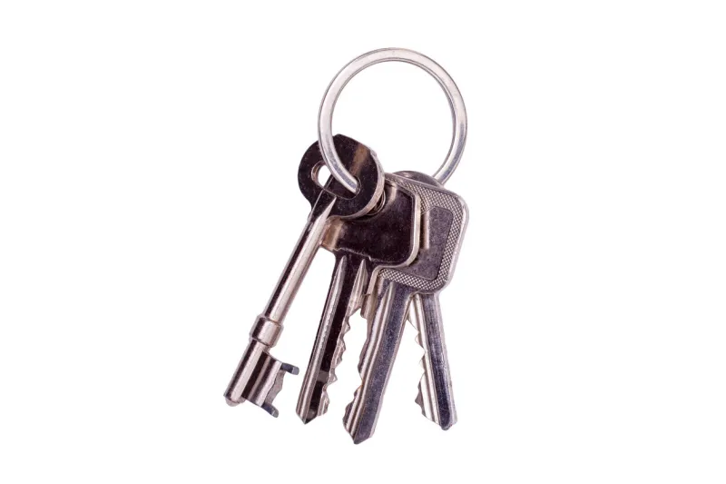 bunch of keys on a keyring isolated on a white background
