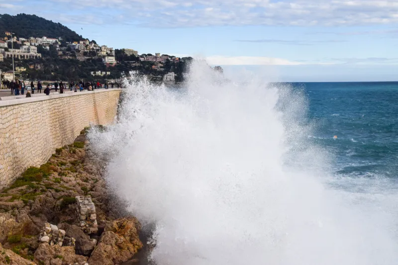 nice, france - november 3 2019  a large wave crashes against a coastal wall