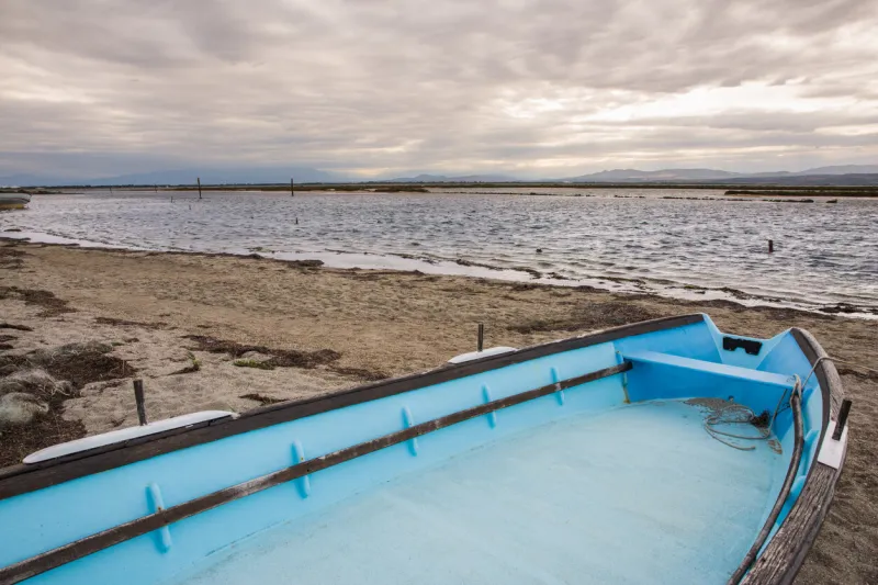 le barcarès fishermen village bay and canigou mountain chain on a cloudy day in france