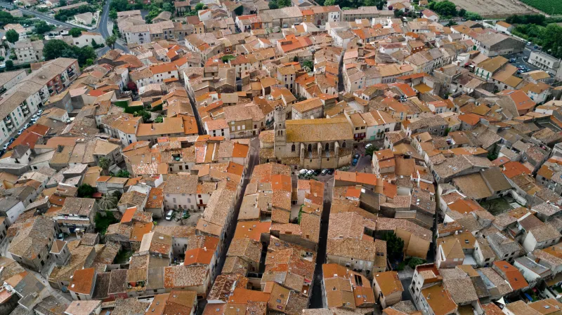 aerial top view of residential area houses roofs and streets from above, old medieval town background, france