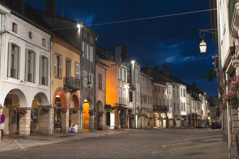 louhans, france - july, 5 2009  the main street of the old burgundy's town at night just after dinner, nobody is on the street all the shops are closed