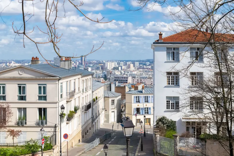 paris, typical street, beautiful buildings in montmartre, france