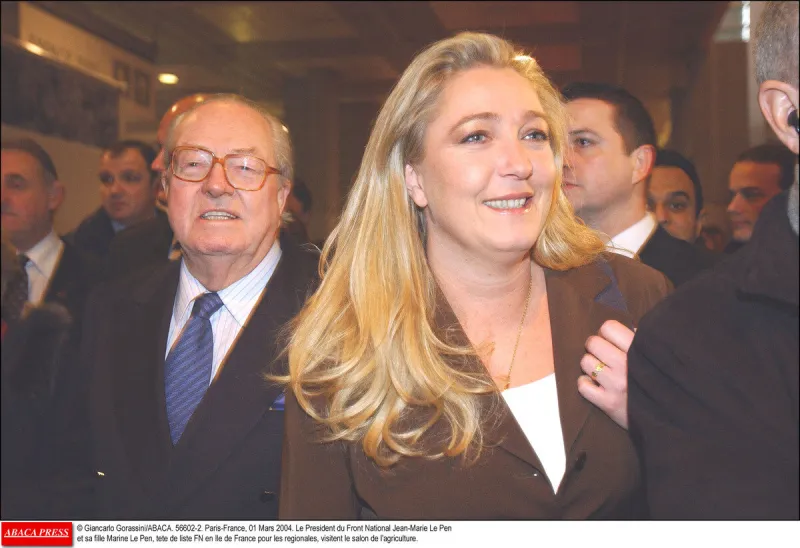 photo d'archive   © giancarlo gorassini abaca 56602-2 paris-france, 01 mars 2004 le président du front national jean-marie le pen et sa fille marine le pen, tete de liste fn en ile de france pour les regionales, visitent le salon de l'agriculture