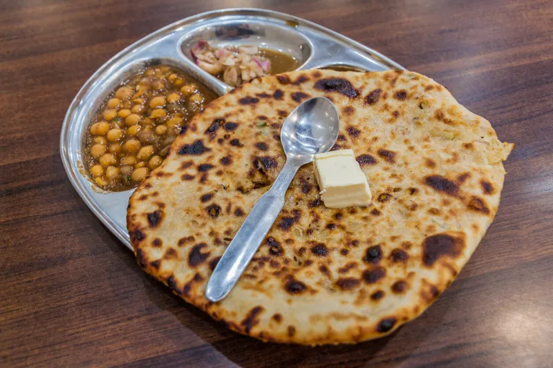 amritsari kulcha clay-baked stuffed naan , typical meal of amritsar, india