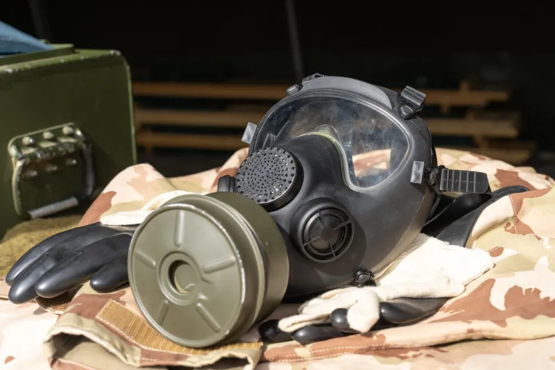older type military gas mask and chemical protection equipment