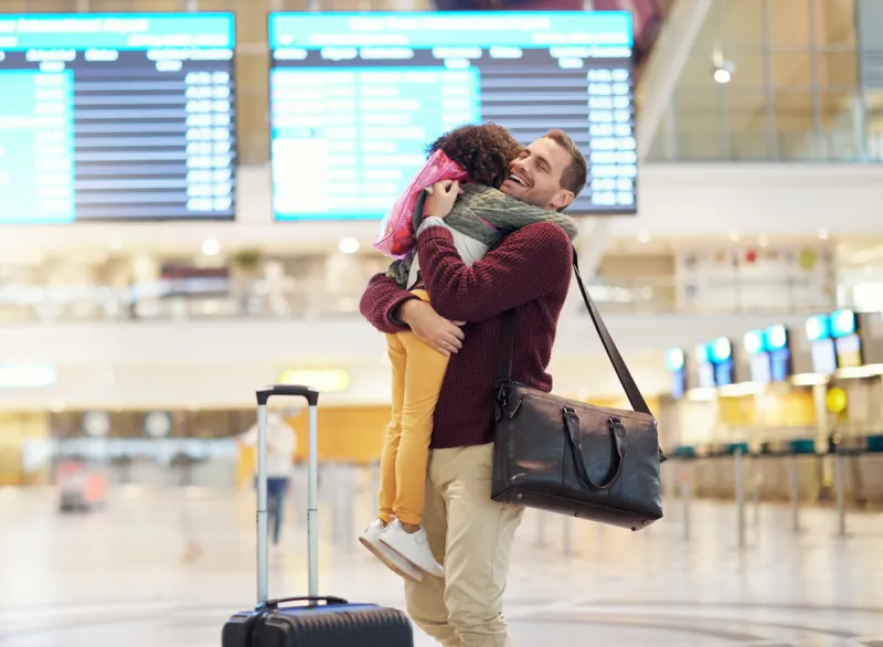 family, father and child hug at airport, travel and girl greeting man after flight, happiness and love with luggage at terminal happy, care and bond with trip, bag and welcome home with reunion