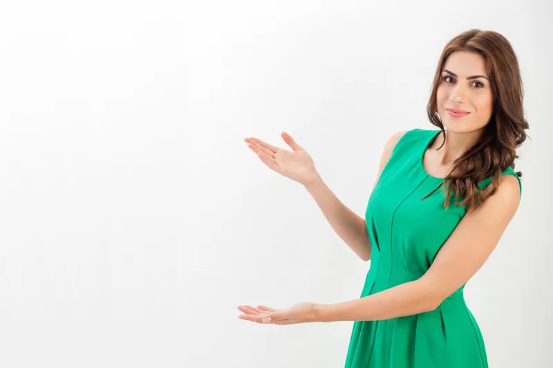 business woman presenting a copyspace isolated on white background vertical image