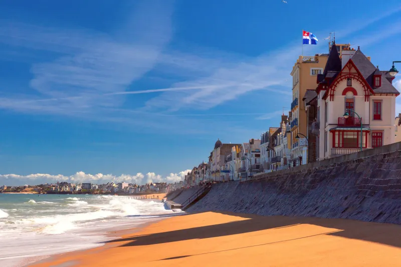 high stone embankment and beach at high tide, in beautiful saint-malo, brittany, france