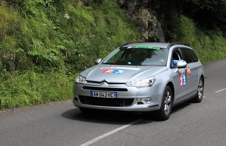 beost,france,july 15th 2011 image of the official car of the france television on the category h climbing route to mountain pass abisque in the 13th stage of the 2011 edition of le tour de france, the biggest cycling race in the world
