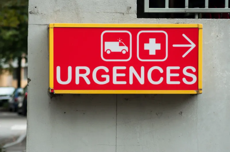 closeup of french hospital emergency entry sign with text in french ( urgences)