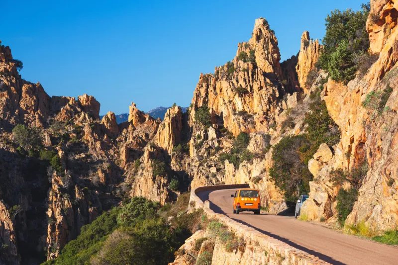 road along the famous calanques de piana in corsica, france