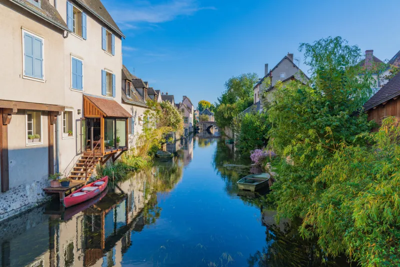 chartres, france - october 9, 2018 - eure river embankment with old houses in the small town of chartres, france