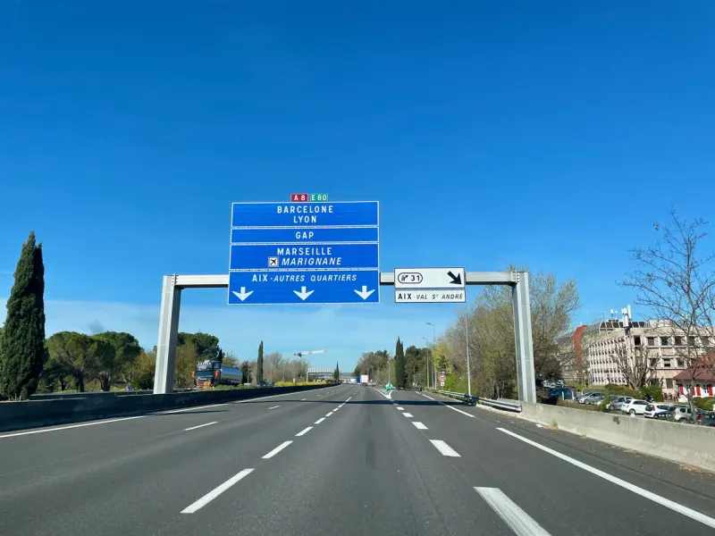 french highway with road sign indicating lyon, marseille, barcelona, gap