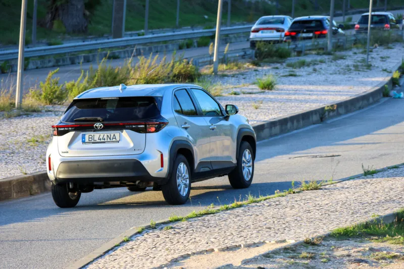 lisbon, portugal october 21, 2024, modern silver toyota yaris cross driving on the road