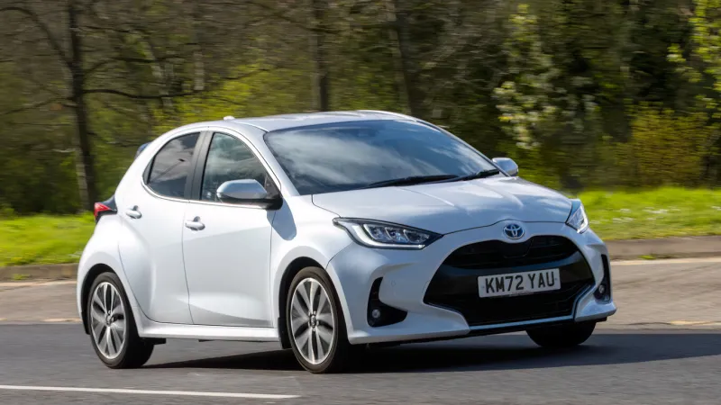 milton keynes,uk-mar 28th 2024 2022 white toyota yaris excel hybrid electric car car driving on a british road