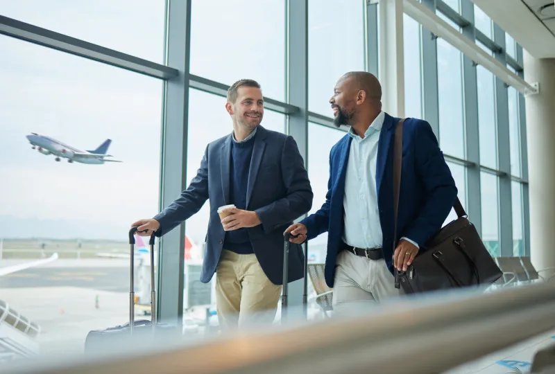 travel for business, team at airport and men, catch flight for work trip with conference or training seminar with accountant walk, talk and diversity with finance convention and partnership