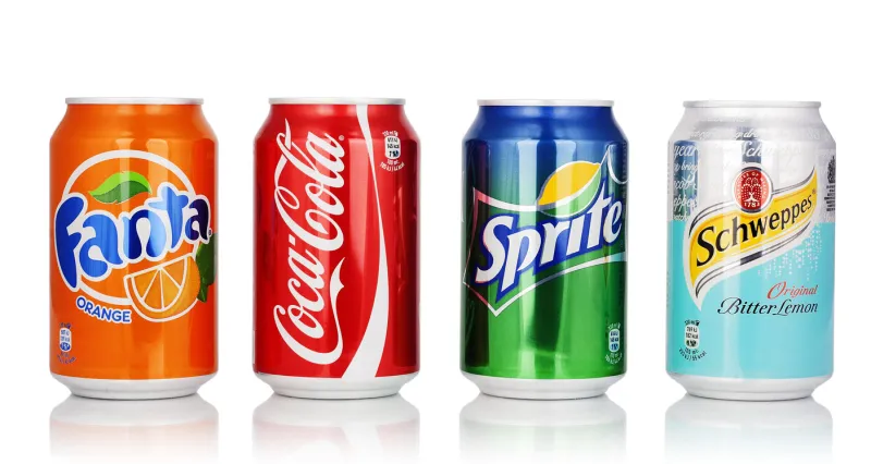 kragujevac, serbia - january 19, 2016  cans of coca cola, fanta, sprite and schweppes isolated on white background coca-cola company made carbonated soft drink