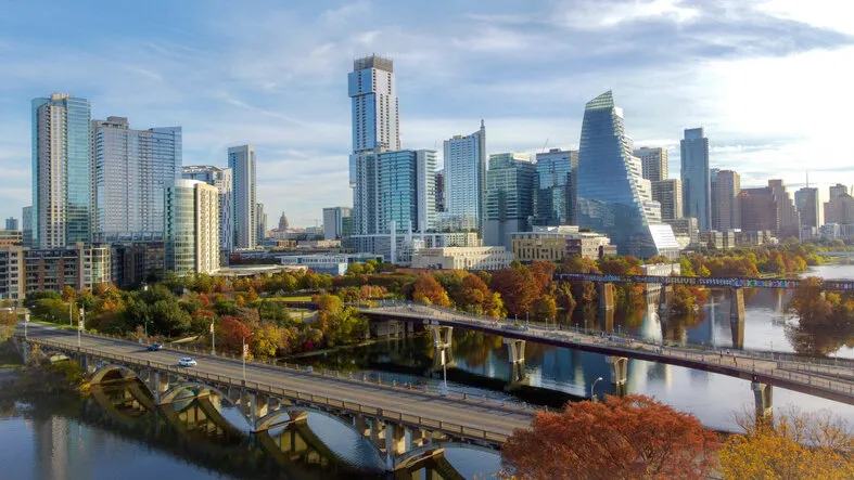 high view of leaves changing color in austin downtown skyline