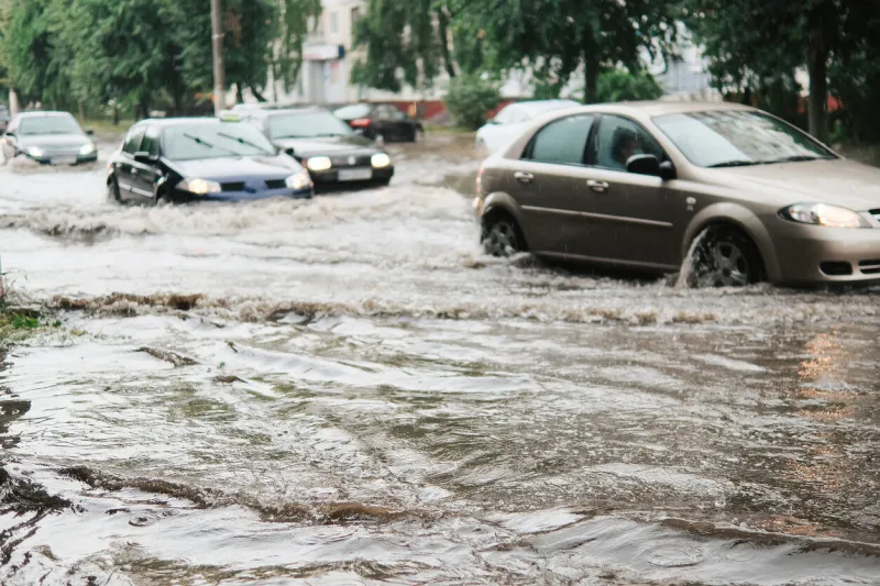 cars on the street flooded with rain