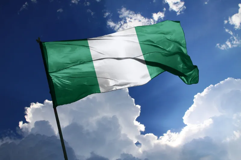 3d illustration flag of nigeria nigeria flag isolated on the blue sky with clipping path