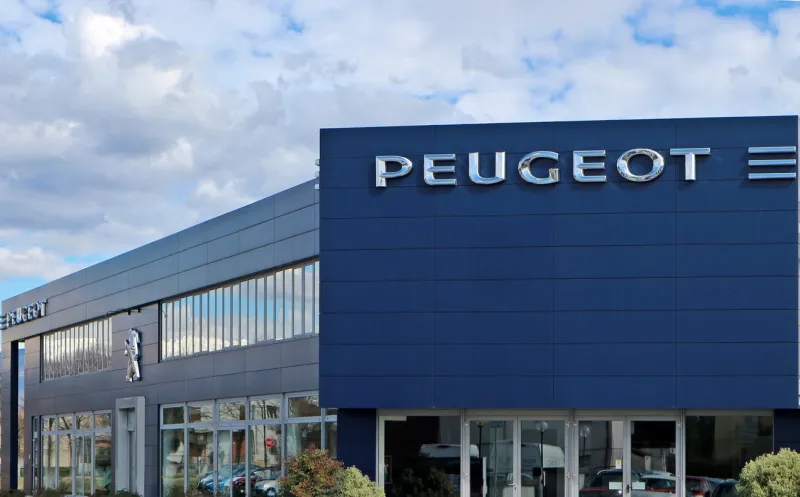 udine, italy march 7, 2020 peugeot dealership in the new headquarter peugeot is a french automotive manufacturer part of psa group