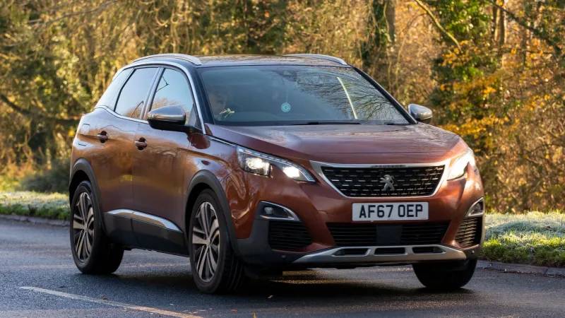 milton keynes, bucks, uk dec 10th 2022 2017 bronze peugeot 3008 diesel car travelling on an english country road
