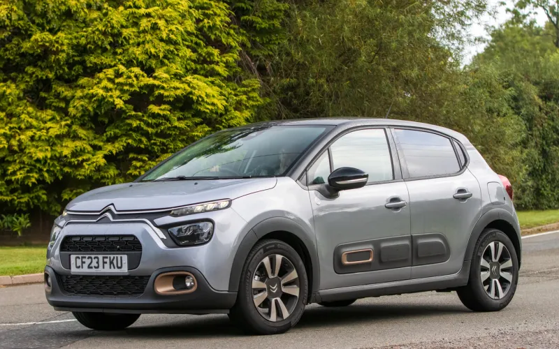 whittlebury,northants,uk -aug 26th 2023  2023 grey citroen c3 travelling on an english country road